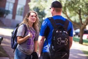 Photo of students explaining stuff to other student